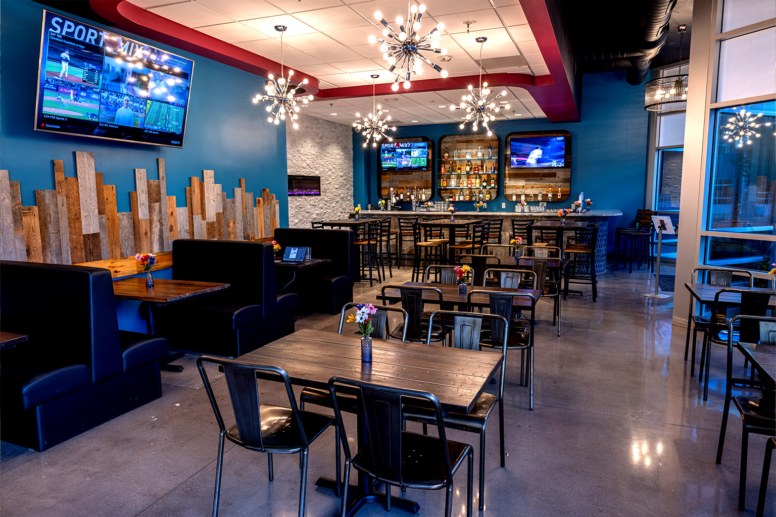Company catering event with communal tables, shared food, and coworkers